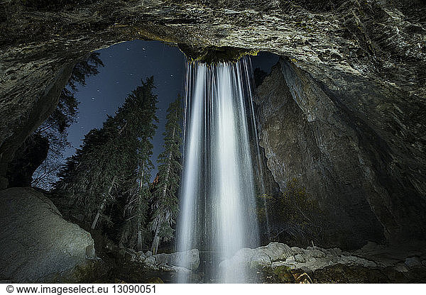 Low angle view of waterfall at Hanging Lake during night