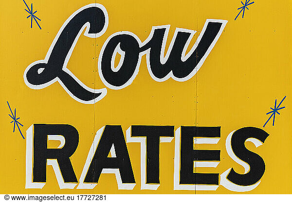 LOW RATES billboard  yellow sign  advertising  close up.