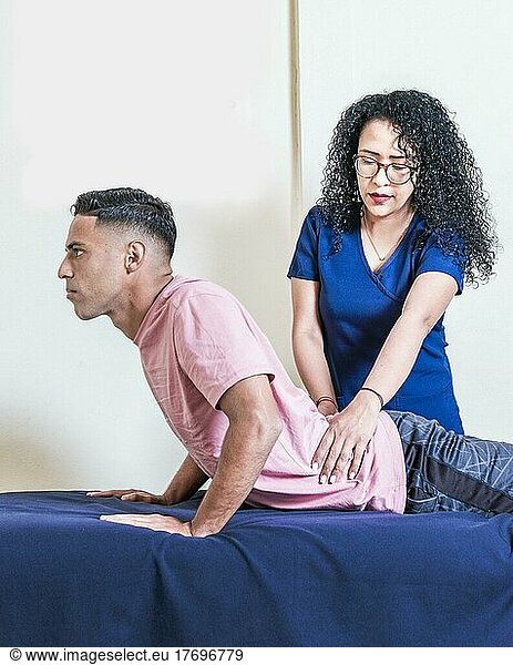 Lower back physiotherapy  physiotherapy treatment concept  physiotherapist with patient