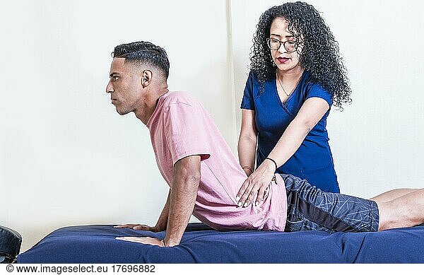 Lower back physiotherapy  physiotherapy treatment concept  physiotherapist with patient