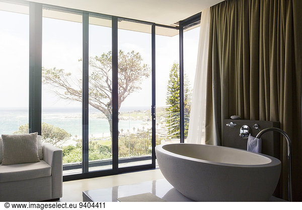 Luxurious bathroom with beautiful view on coast