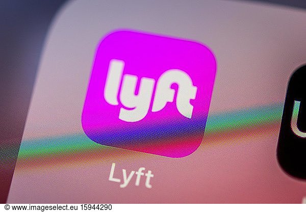 Lyft App  taxi service  icon  logo  display  iPhone  mobile phone  smartphone  iOS  macro shot  detail  full format