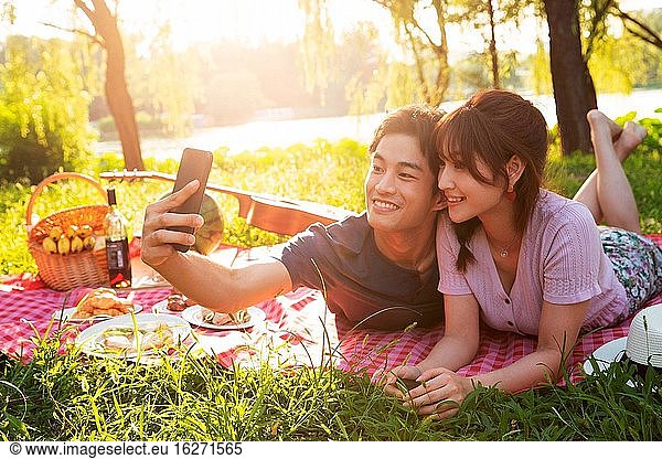 Lying on the grass pictures of happy couples