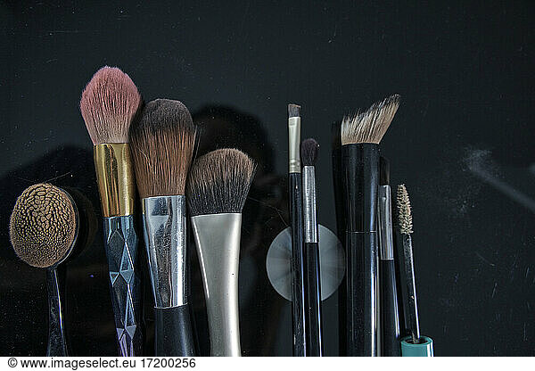 Make-up brushes on black table
