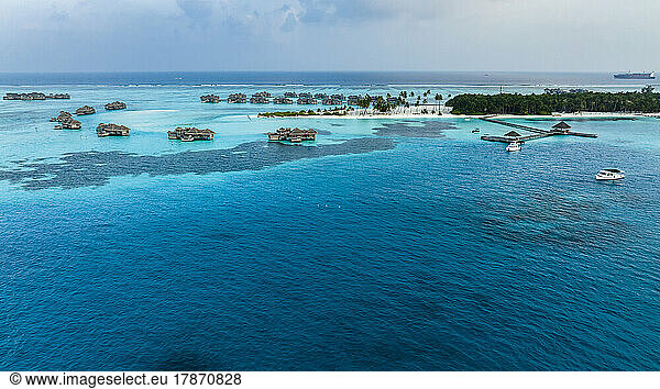Maldives  North Male Atoll  Lankanfushi  Aerial view of Indian Ocean with tourist resort bungalows in background