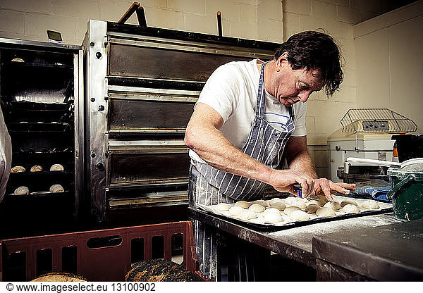 Male baker working in commercial kitchen