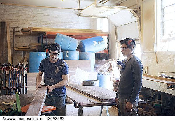 Male carpenters working in workshop