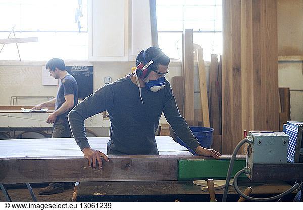 Male carpenters working in workshop