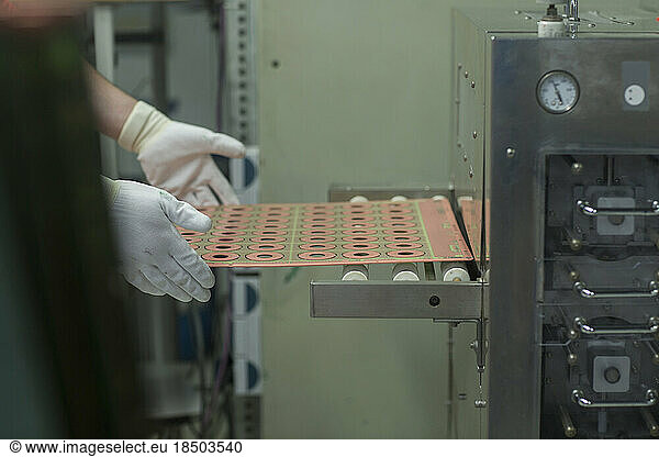 Male engineer hands holding circuit board in industry  Hanover  Lower Saxony  Germany
