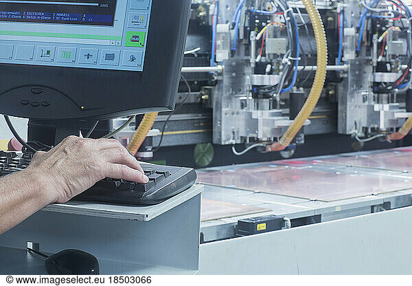Male engineer working on computer in industry  Hanover  Lower Saxony  Germany