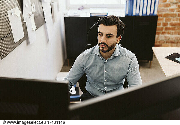 Male entrepreneur working at creative office