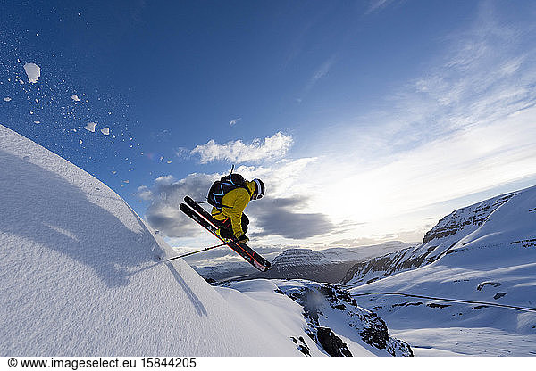 Male Extreme skier flying through the air.