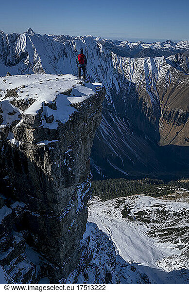 Male hiker standing at edge of Namloser Wetterspitze peak