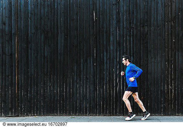 Male Running In The City