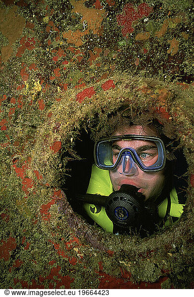 Male scuba diver on shipwreck  Grand Cayman