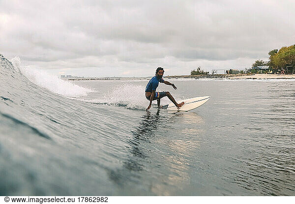 Male surfer on a wave  Maldives
