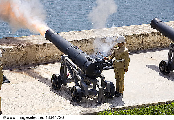 MALTA Valletta Firing of the noon day gun  at the Saluting Battery  Upper Barracca Gardens