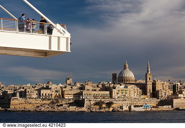 Malta  Valletta  skyline with St Paul´s Anglican Cathedral and Carmelite Church from Tigne Point footbridge  sunset