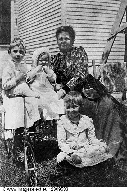 MAMIE EISENHOWER (1896-1979). Wife of President Dwight D. Eisenhower. Mamie (left) as a young girl with her sisters  Eda (center) and Eleanor (seated in front)  and an unidentified woman. Photograph  early 20th century.