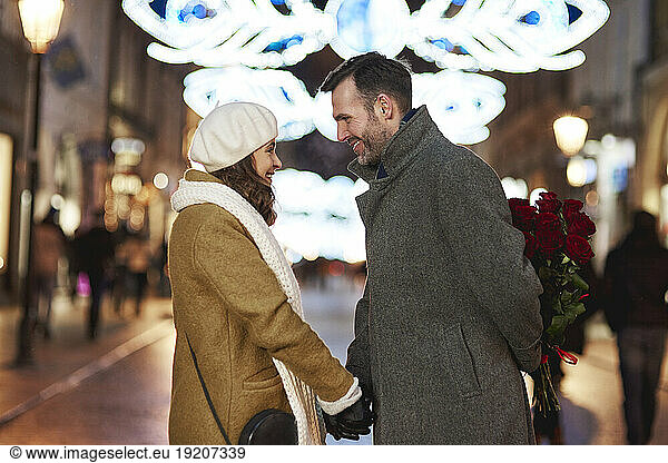 Man and girlfriend meeting in the evening of Valentine's Day