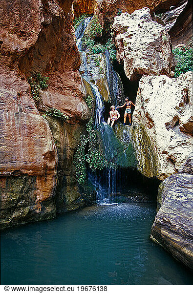 man and woman in lush desert canyon  Grand Canyon  Arizona