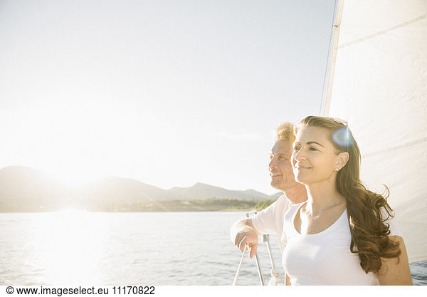 Man and woman on a sail boat.