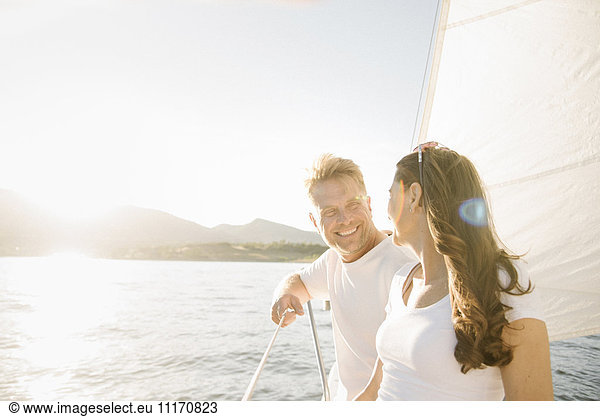 Man and woman on a sail boat.