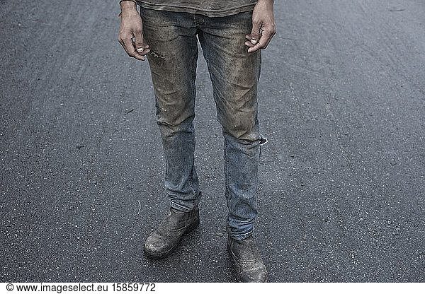 Man at work with very dirty clothes