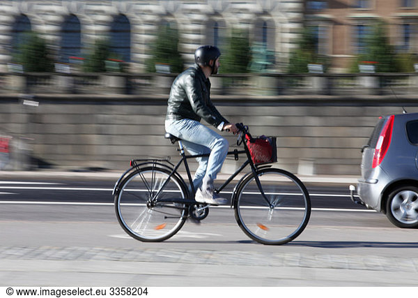Man biking down the street
