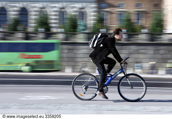 Man biking on cycle lane