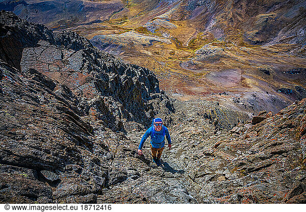 Man Climbing Wetterhorn Peak in the San Juan Mountains of Colorado