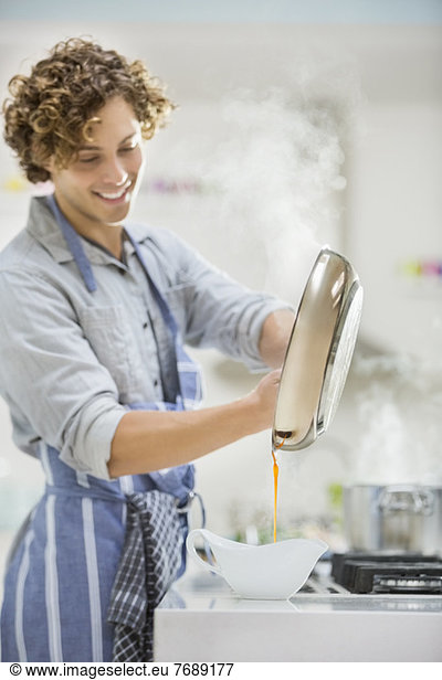 Man cooking in kitchen