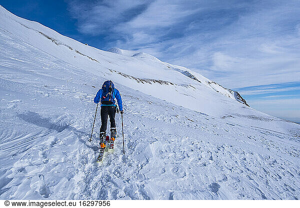 Man cross-country skiing on Sibillini mountain against sky  Umbrian  Italy