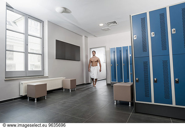 Man fitness studio changing rooms locker towel