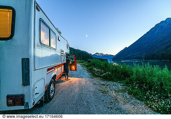 Man getting out of motorhome at Duffy Lake  British Columbia  Canada