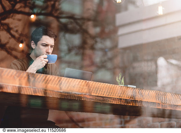 Man having coffee at cafe