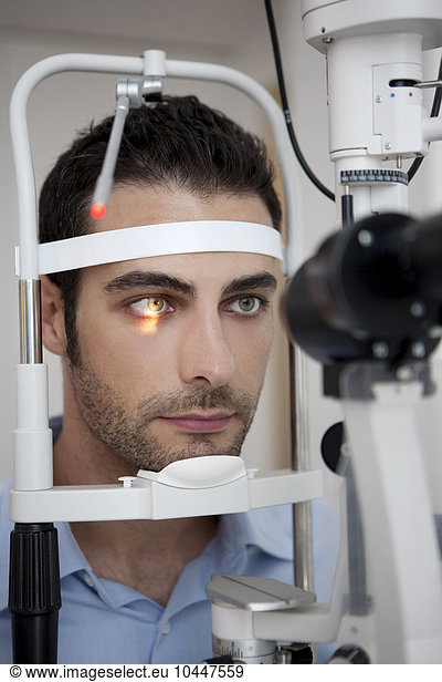 man having his eye's tested
