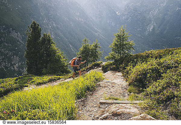 Man hiker going up to Aiguillette des Posettes  French Alps  Chamonix