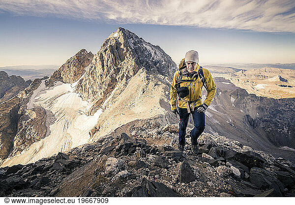 Man hiking and climbing the Grand Teton in Grand Teton National Park  Wyoming.