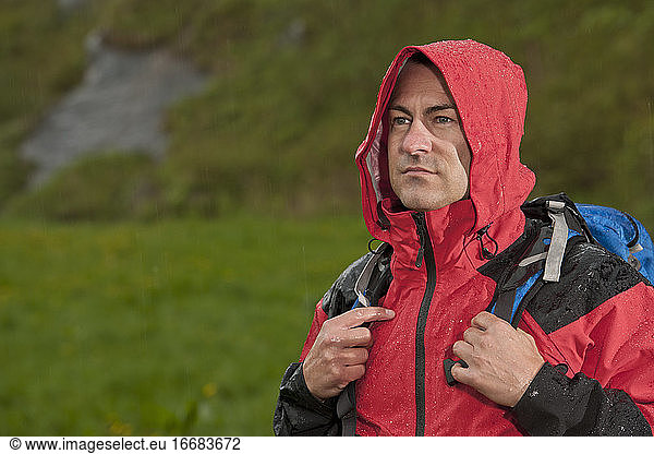 man hiking in the rain in England