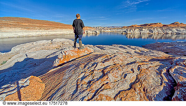 Man hiking near the shore of Lake Powell AZ