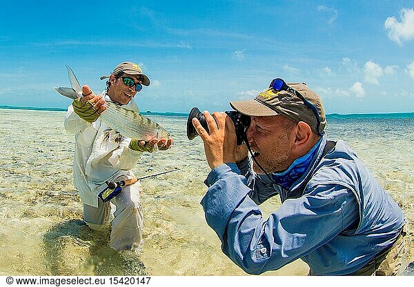 Man holding Bonefish to Fishing Photo in los Roques - venezuela.