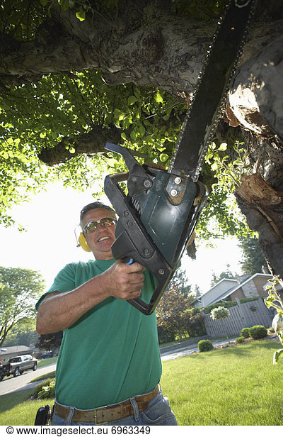 Man Holding Chainsaw