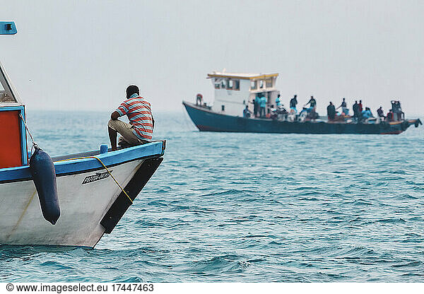 Man in a boat  Indian Ocean  Maldives