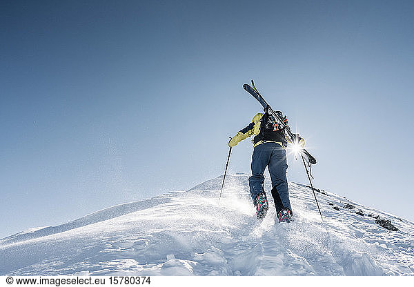 Man in backlight on ski tour  Grisons  Switzerland