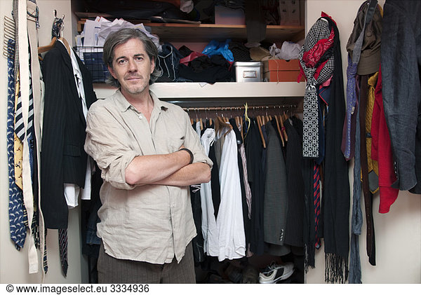 man in front of wardrobe