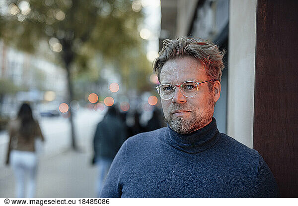 Man in turtleneck wearing eyeglasses