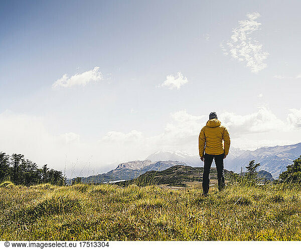 Man looking at view while standing on mountain in Patagonia Argentina South America