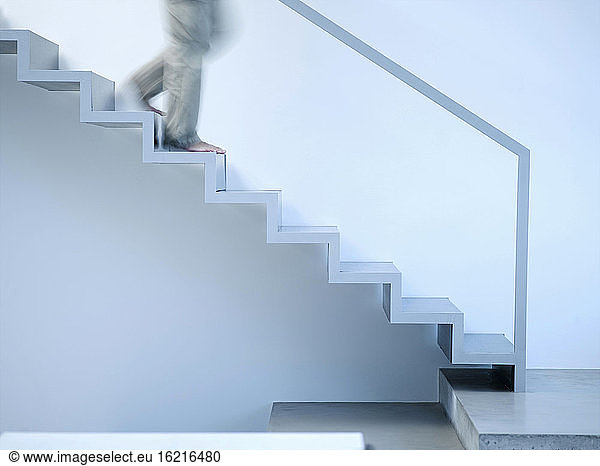 Man moving down stairs  side view
