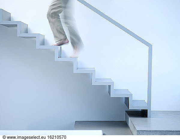 Man moving up stairs  side view